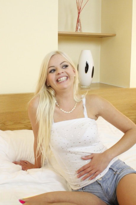 Blonde teen May gets spit roasted & takes a facial in a hot MFM threesome