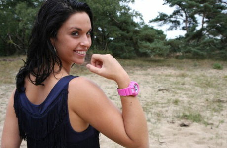 Brunette girl Nora is handcuffed to a tree while wearing a pink G-Shock watch
