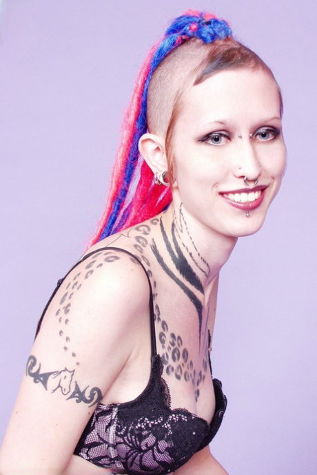 Tattooed girl Jax sticks her tongue out after stripping to her goth boots