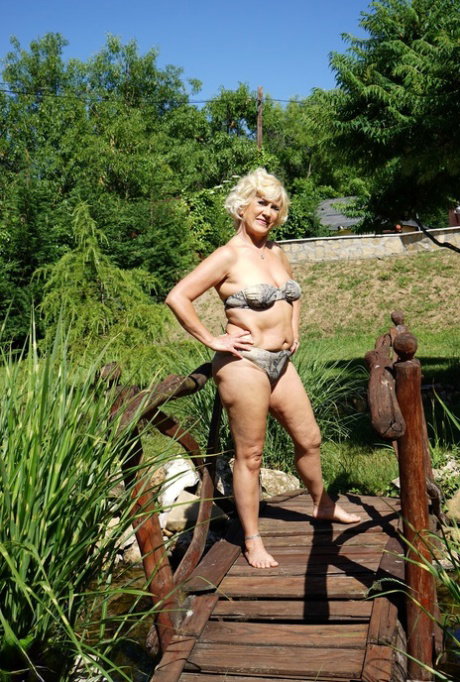 European mature Petunia reveals her chubby body and masturbates indoors