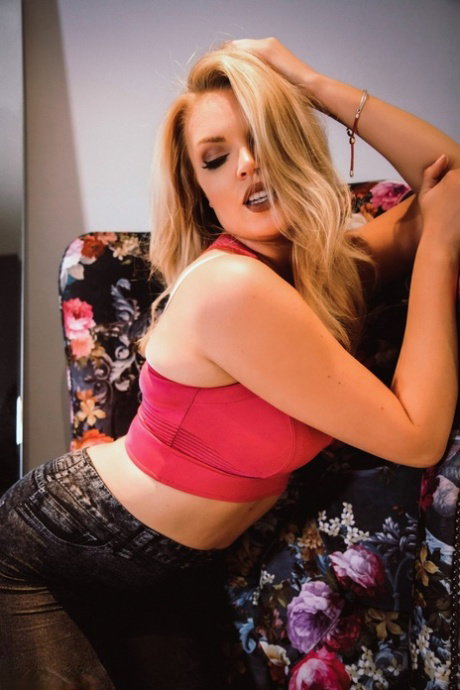 Sexy blonde Porchia Watson undoes her bra to expose her firm breasts