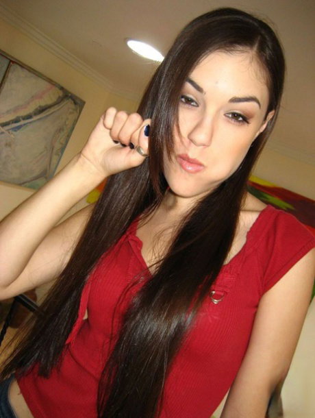 Young skinny pornstar Sasha Grey reveals her tiny tits and narrow pussy hole