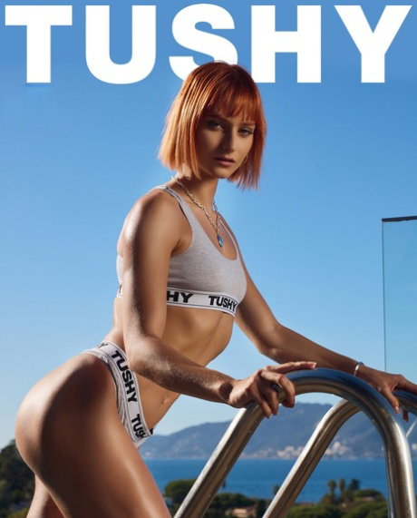 Stunning redheaded pornstar Dolly Dyson unveils her ass before a DP 3some