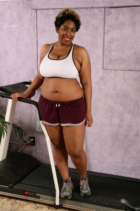 Middle-aged BBBW cups her huge tits as she takes off her workout clothes