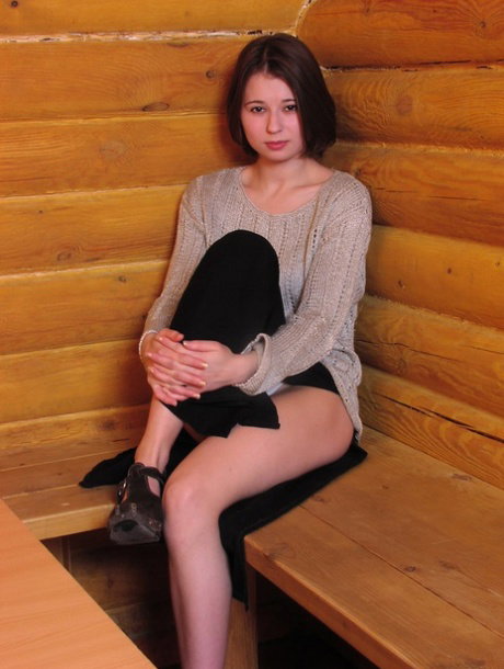 Sexy big boobed European teen Lena masturbating with a toy in a log cabin