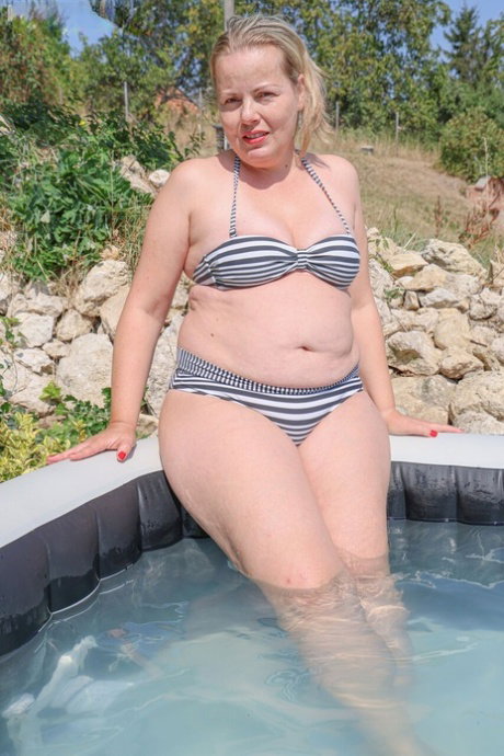 Fat blonde MILF has sex with her man friend after a hot tub dip
