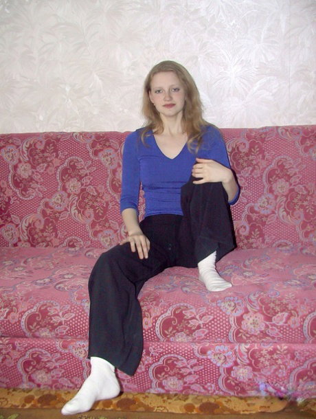 Skinny amateur babe Lusya undresses and touches her trimmed pussy