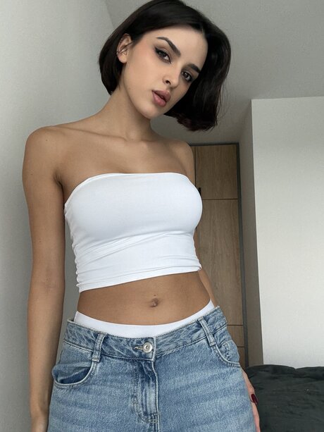 Pretty brunette Lory Dark 21 takes off her jeans in a tube top and underwear