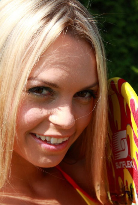 Skinny teen Sabrina Blond takes off her bikini while in the backyard