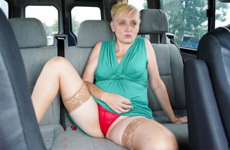 Mature blonde has pussy to mouth sex in the back of a camper van