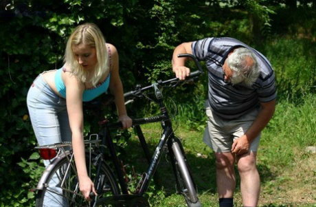Young blonde Susan gives senior outdoor blowjob & doggystyle for bike repair