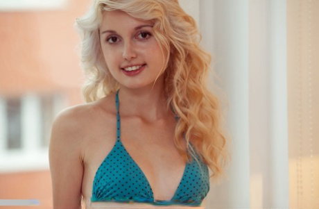 Alluring blonde Ashlin reveals her tiny tits & spreads her legs for a closeup