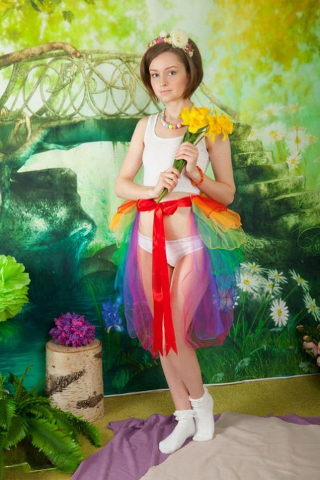 Adorable teen Caramel strips to frilly socks with flowers in her hair