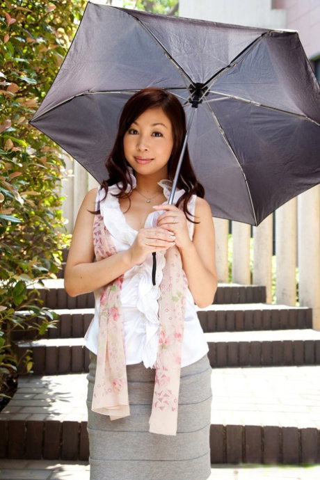 Pretty Japanese girl Shiori Mizoguchi models with her clothes on