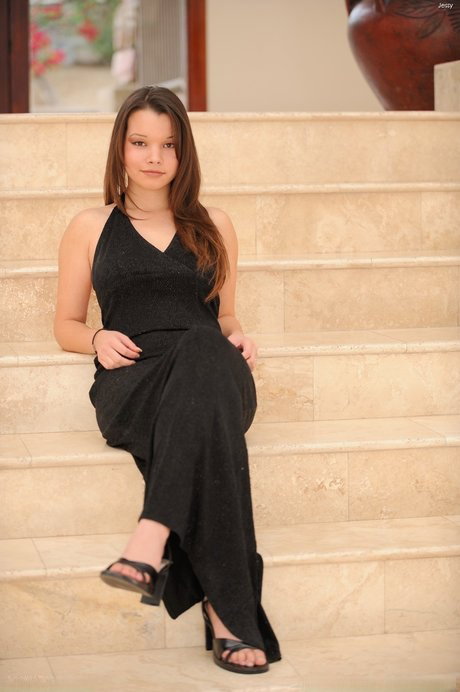 Cute teen in a black dress Jessy exposes her hot cunt and nice big tits