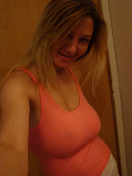 Blonde amateur Vanessa takes selfies of her big boobs while wearing a thong
