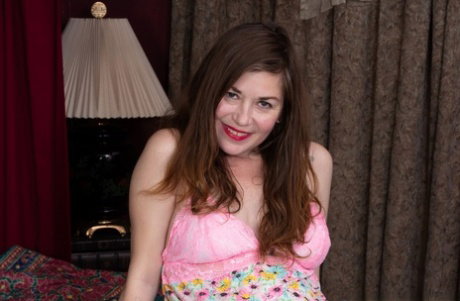 Amateur woman Ophelia Jones toys her bush while wearing OTK socks