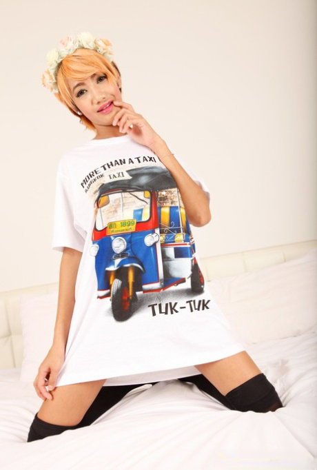 Asian cutie Omsin poses for the camera in a shirt and knee socks