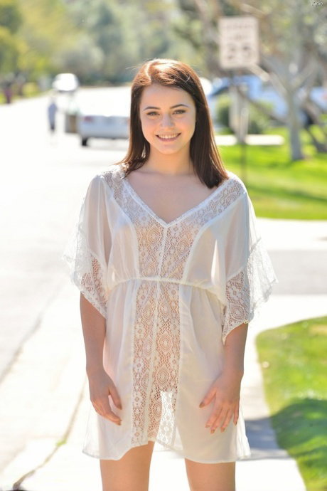 Sweet young girl in sheer with dress flashing her naked ass outside in the sun