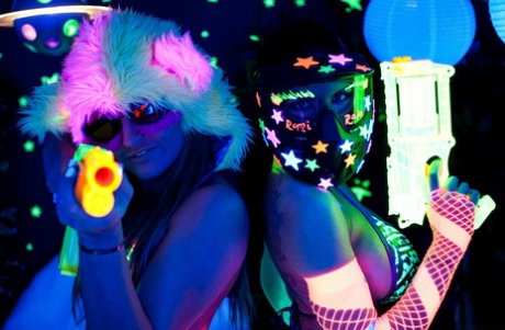 Lesbian strippers Dani Daniels & Romi Rain licking pussy under UV lights