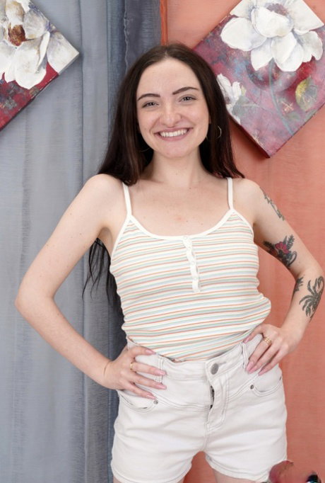 Nice teen Leia Rae holds her big butt after getting totally naked