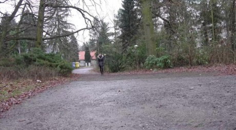 White girl Cynthia Vellons squats to take a piss next to an isolated building