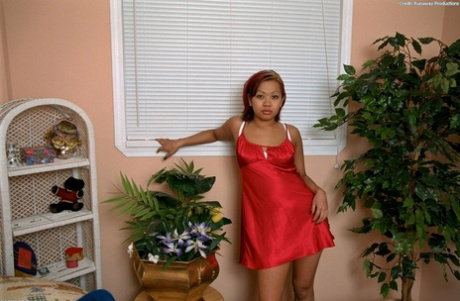 Pretty Asian amateur Gia slipping out of red nightie and lace lingerie