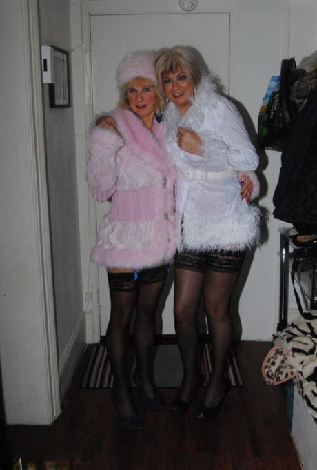 Mature blondes strips off winter attire and lingerie in side by side action