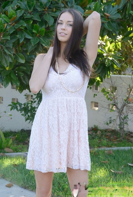 Dirty brunette babe Madi Meadows shows off her big tits & poses naked outdoors