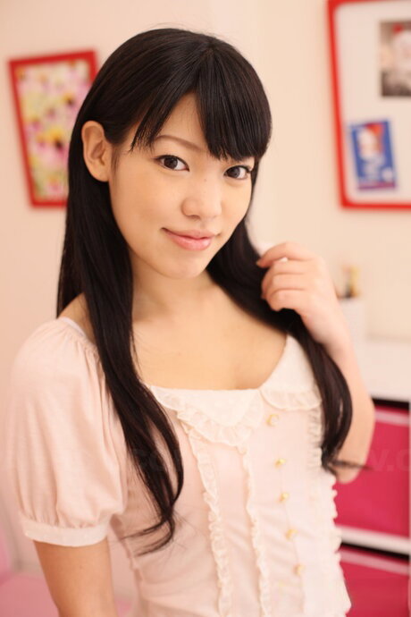 Japanese solo girl Chiharu Miyashita uncovers her firm tits before pulling down