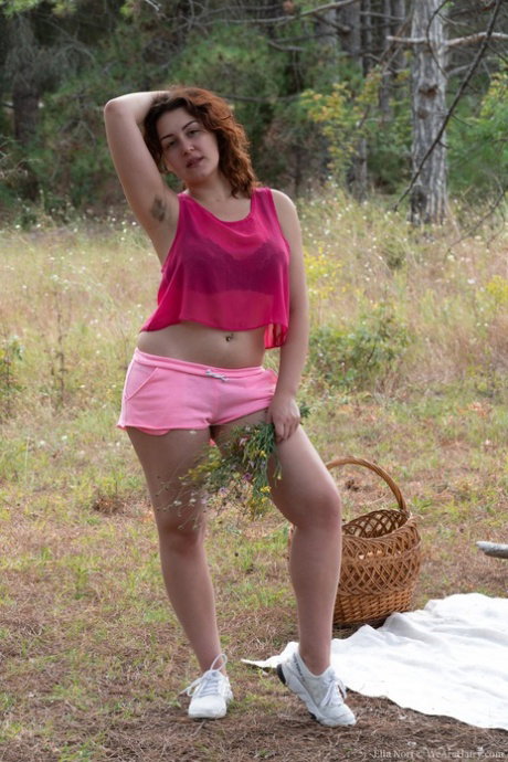 Amateur Ella Nori shows her hairy armpits before masturbating outdoors