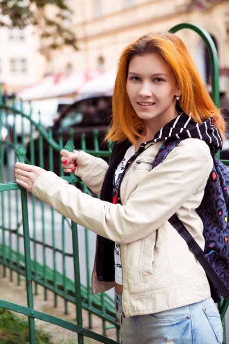 Leggy teen with red lips removes her lingerie to pose nude with her hair up