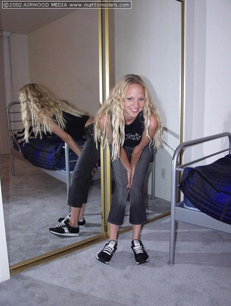 Natural blonde Ivy makes her nude debut in front of a bedroom mirror