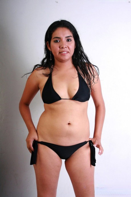 Latina teen Lorena takes off a black bikini during a solo engagement