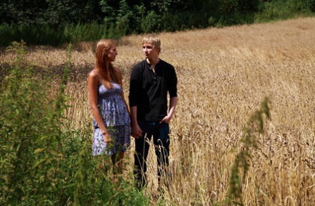 Young girl takes a cumshot on her big natural tits after sex in a crop field