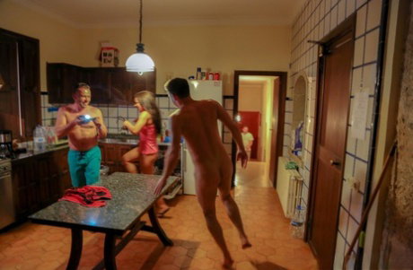 Three sexy girls have a threesome on a kitchen counter during a hot summer