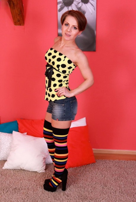 Redhead with short hair Sasha Zima strips down to long, multi-colored socks