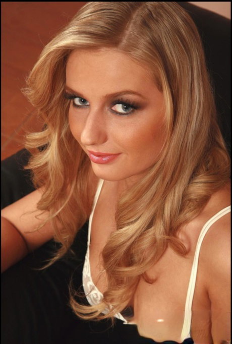 Blonde babe Nikol W flaunts her big boobs and toys her pussy in a solo
