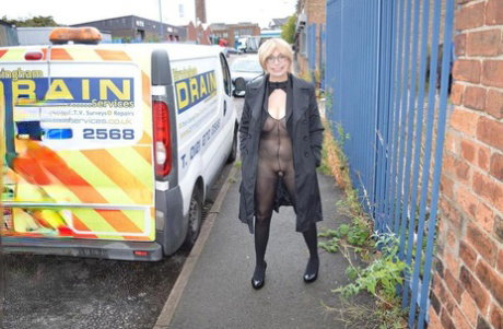 Mature woman flashes her tits and twat on sidewalk and in sex shop
