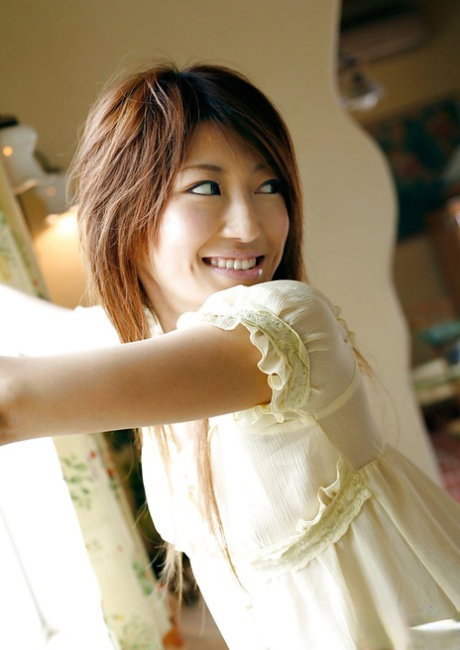Foxy asian teen Yu Satome taking off her dress and posing in panties