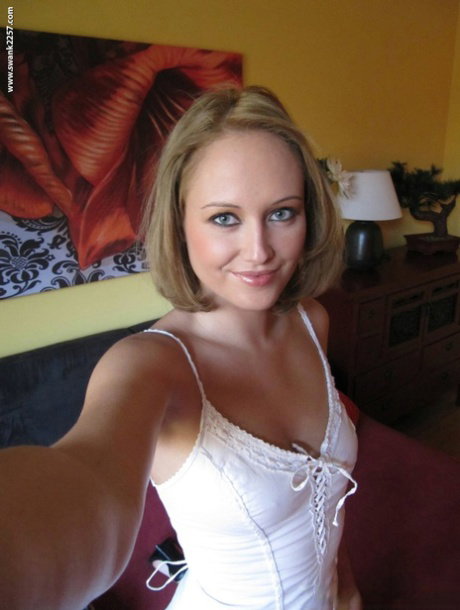 Blonde teen with sexy eyes Nolana taking selfies of her sweet tanned tits