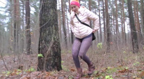 Blonde girl Anya pulls down her pants for an urgent piss while in a forest