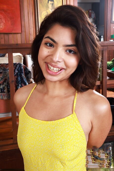Petite teen Hazel Heart displays her bald twat after getting totally naked