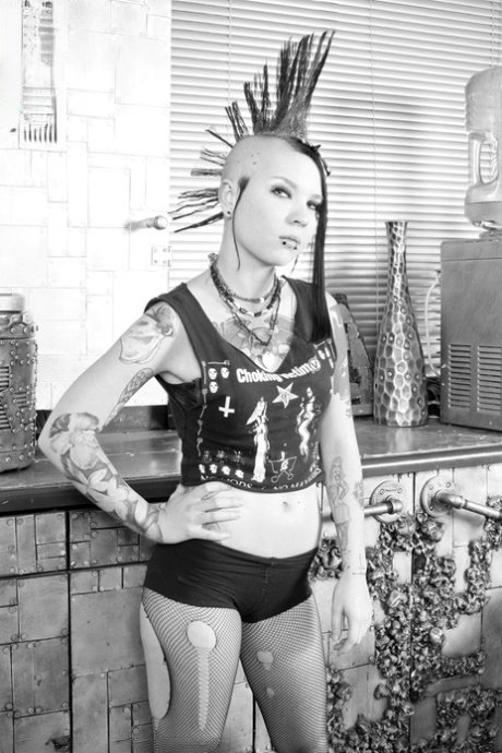 Alternative girl Tara Toxic ends up standing nude during a black and white gig