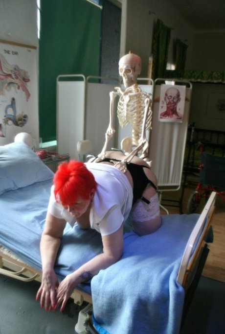 Older redheaded BBW Valgasmic Exposed has sexual relations with a skeleton