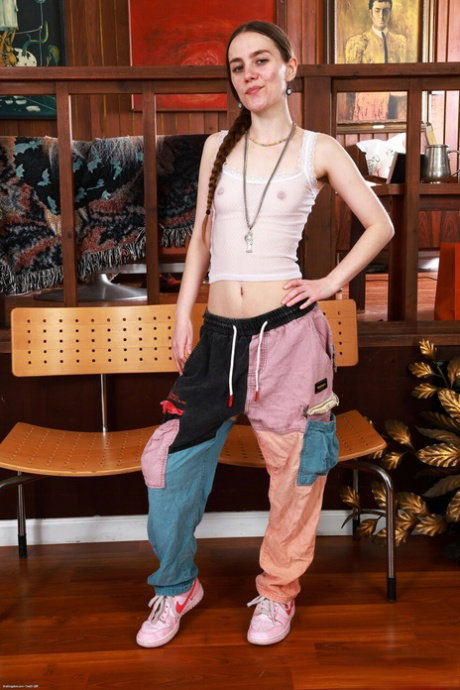Skinny teen Sia Wood shows her bush after stripping to her socks