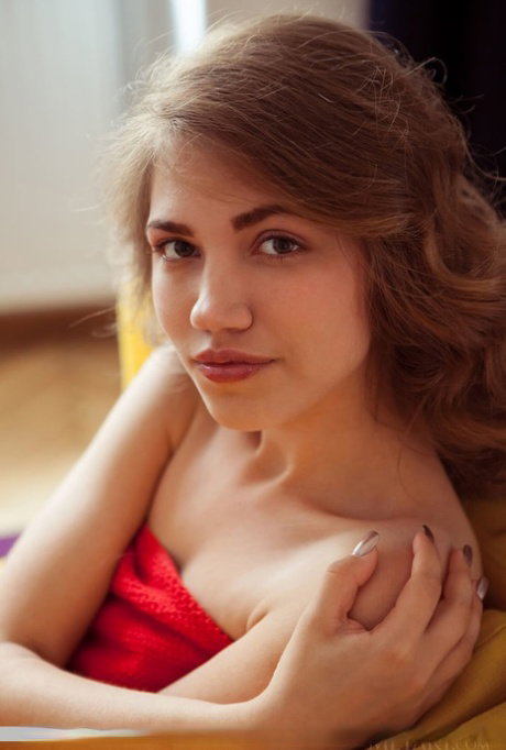 Teen model Jasmina casually displays her nice ass and bald slit while naked