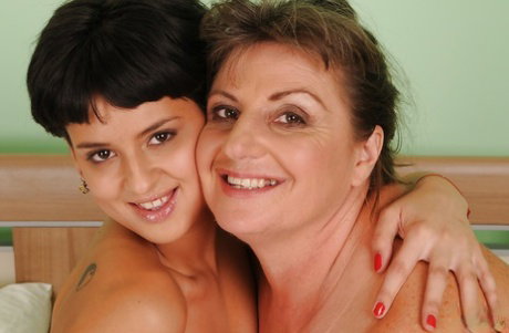 Naughty teen Coco de Mal has some fun with her mature lesbian friend