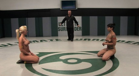 DragonLily and Holly Heart engage in a bout of lesbian wrestling