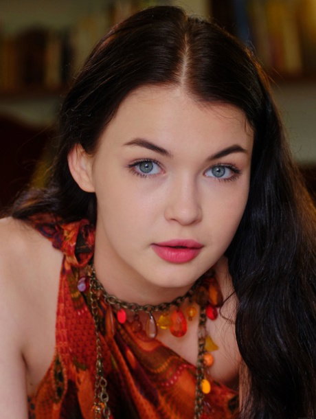Sweet teen with striking eyes and red lips masturbates her bald pussy